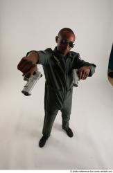 ERIC STANDING POSE WITH GUNS